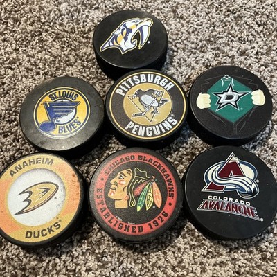 NHL Hockey Puck Lot Of 7 Avalanche, Blues, Ducks, Penguins +