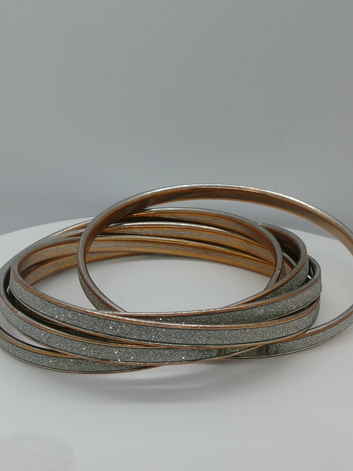 Six metal interlocking Round Bangles Silvertone W… - image 1