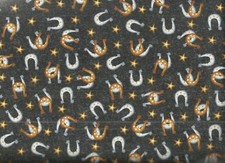 Wild Wild West black horseshoes gold stars western Studio e fabric