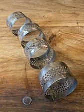 4 VINTAGE SILVER PLATED NAPKIN RINGS FRET WORK CENTRES