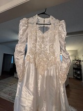 Beautiful lace and beaded wedding dress and veil. Back hanging pearls.