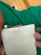 Pochette Tod’s in pelle bianca con zip dorata