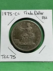 1875-CC US Trade Dollar Raw AU Coin