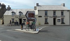 Photo Pub - Bicycle and directions signs The Bishops St David's c2014