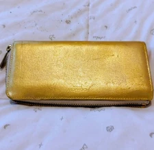 Famous brand COACH. Luxurious gold-tone long wallet with round zipper.
