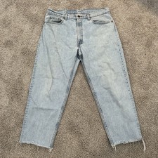 Vintage Levi’s 550 Jeans Made In USA Light Wash Denim Distressed 38x26 Raw Hem