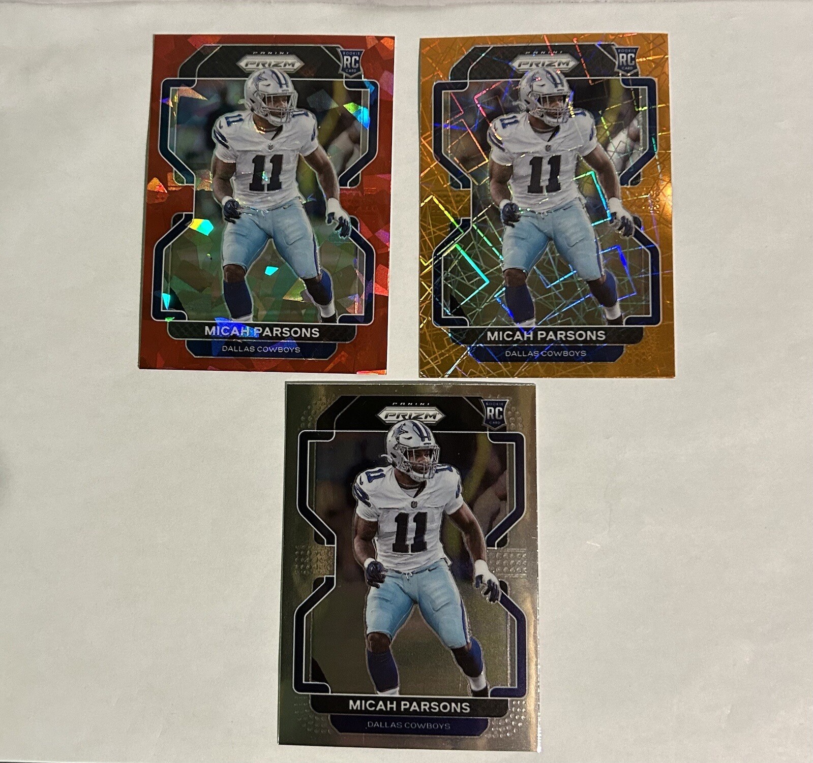 MICAH PARSONS 2021 PANINI PRIZM RED CRACKED ICE ORANGE LASER PRIZM ROOKIE #382