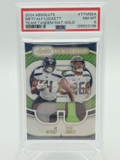 2024 Panini Absolute Team Tandem Materials DK Metcalf, Tyler Lockett /99 PSA 8