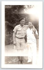 1940s Photo Of Man Helping British Soldier In Tropical Uniform Black White