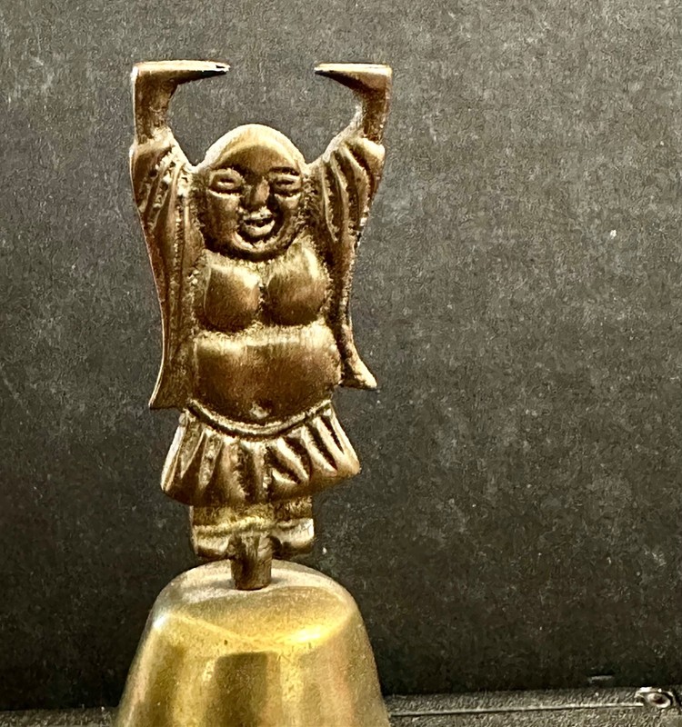 A Brass 'Figural Bell, patina finish from the brass "A Happy Buddha Design"