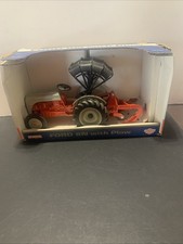 1/16 Ertl Ford 8N tractor with plow and canopy in the box. IN BOX