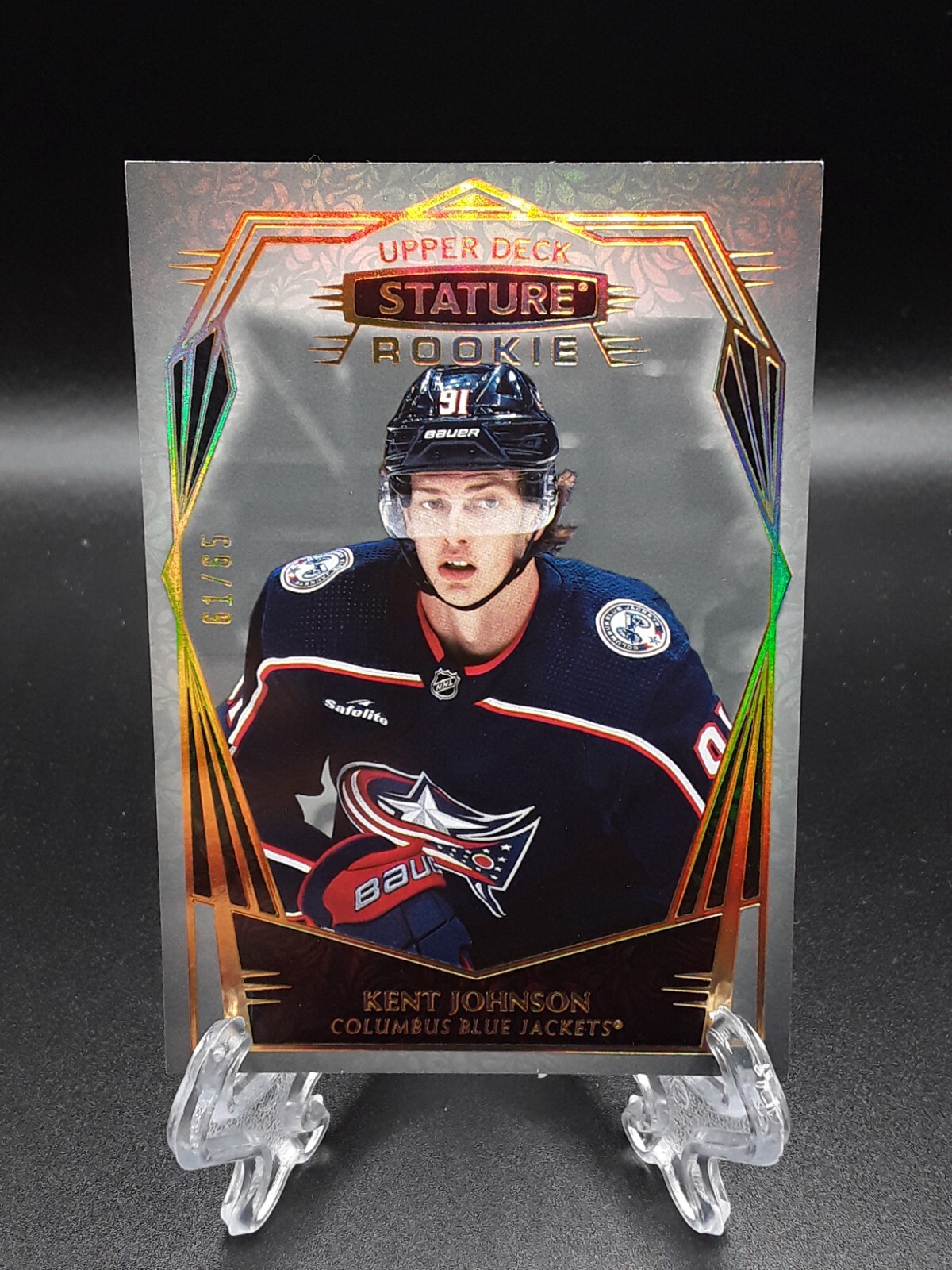 2022-23 Upper Deck Stature Kent Johnson Design Variation /65 Blue Jackets