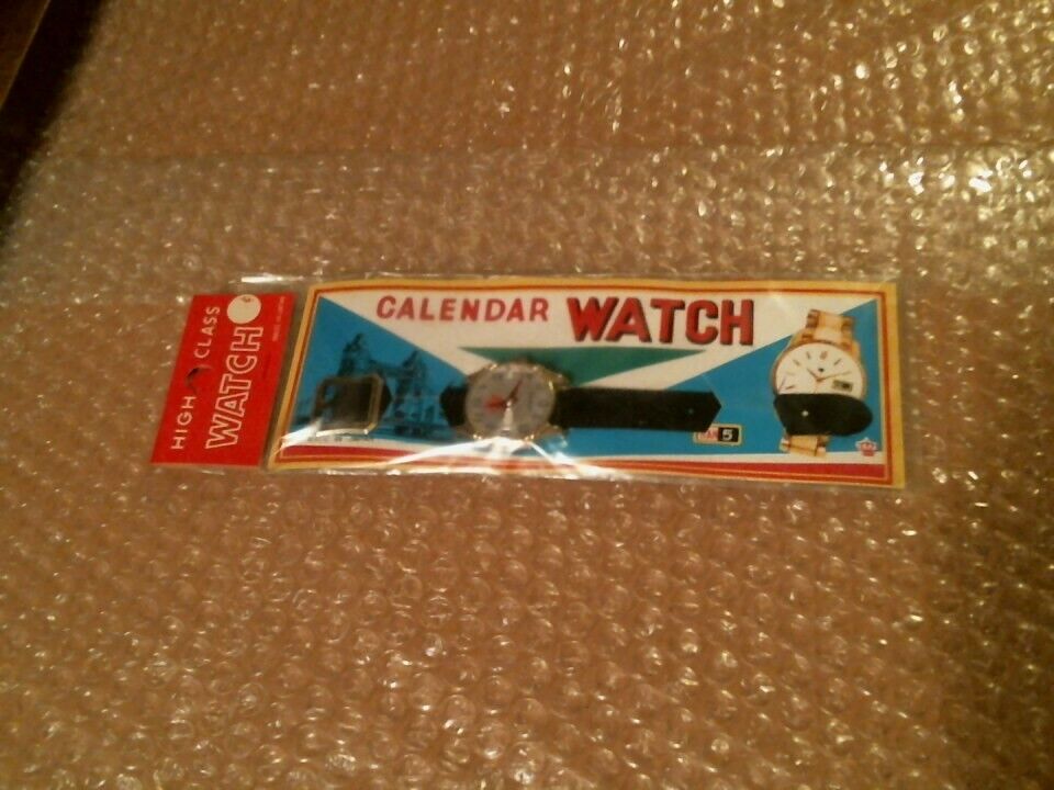 VINTAGE OLD CARDED TOY CALENDAR WATCH IN ORIGINAL PACKAGE MADE I