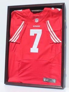 displaying jerseys on a wall