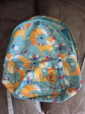 Mochila juvenil verde azulado y naranja con tema floral de zorro