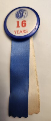16 years employed by Procter & Gamble button, ribbon 
