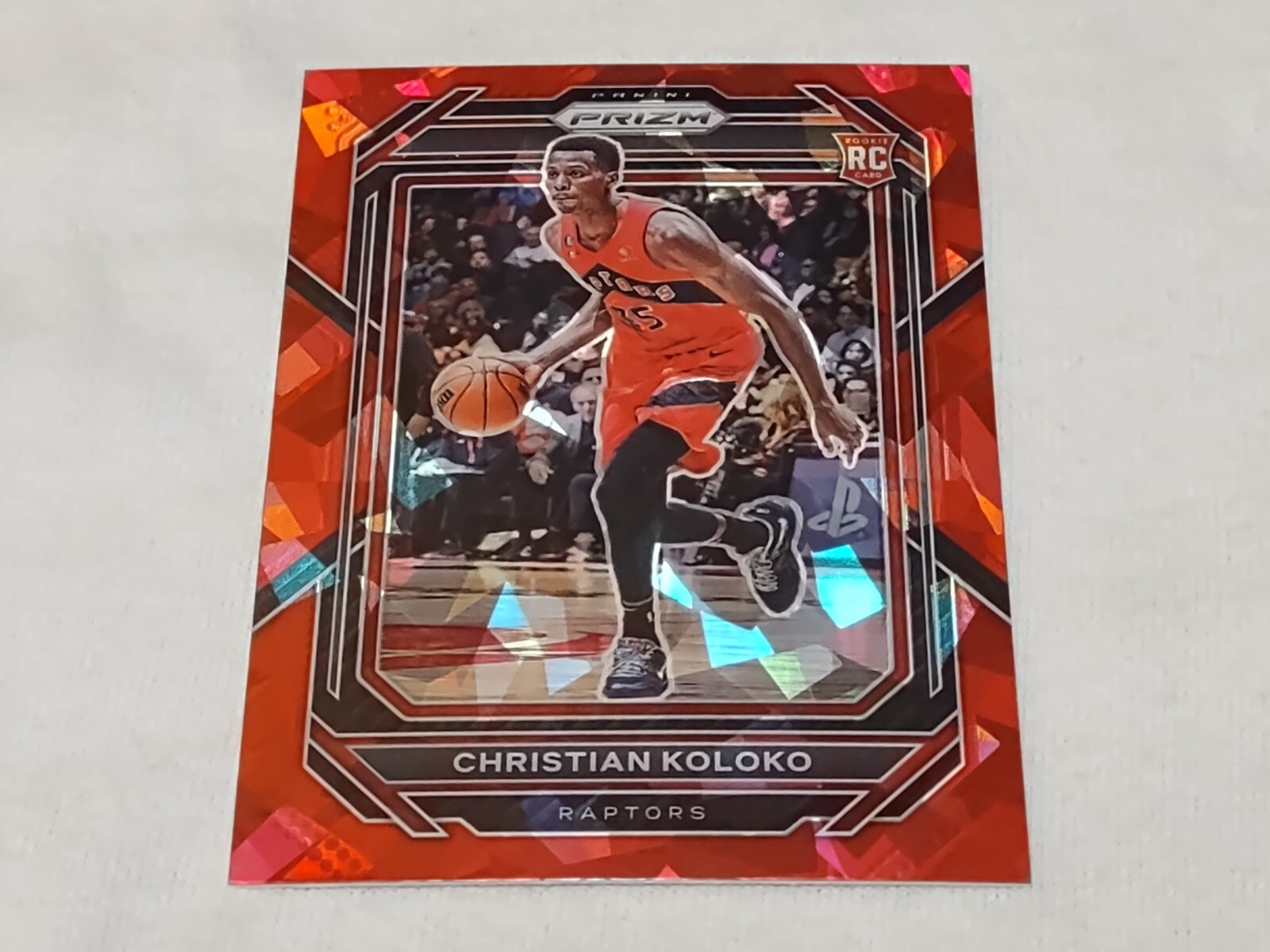 Christian Koloko 2022-23 Panini Prizm Red Ice 265 Rookie Parallel Raptors