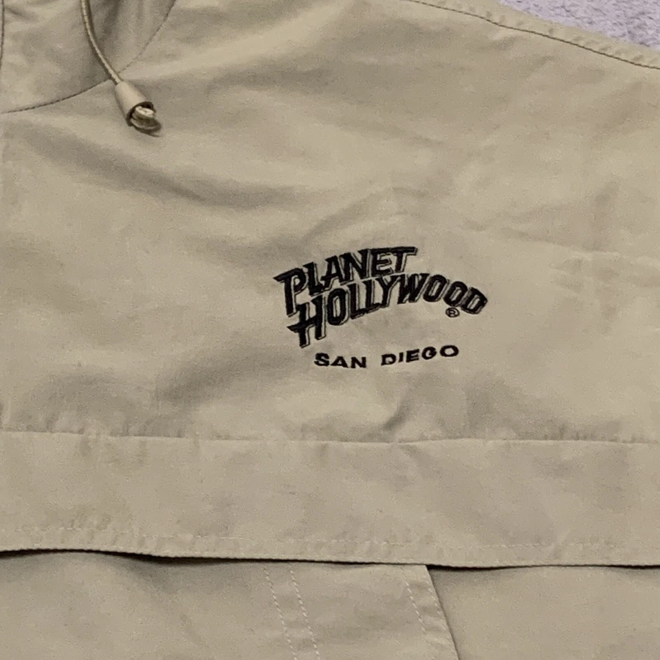 Jaqueta corta-vento masculina vintage Planet Hollywood 2XL capuz 1/4 zíper bege defeito 1998 - Imagem 2 de 4