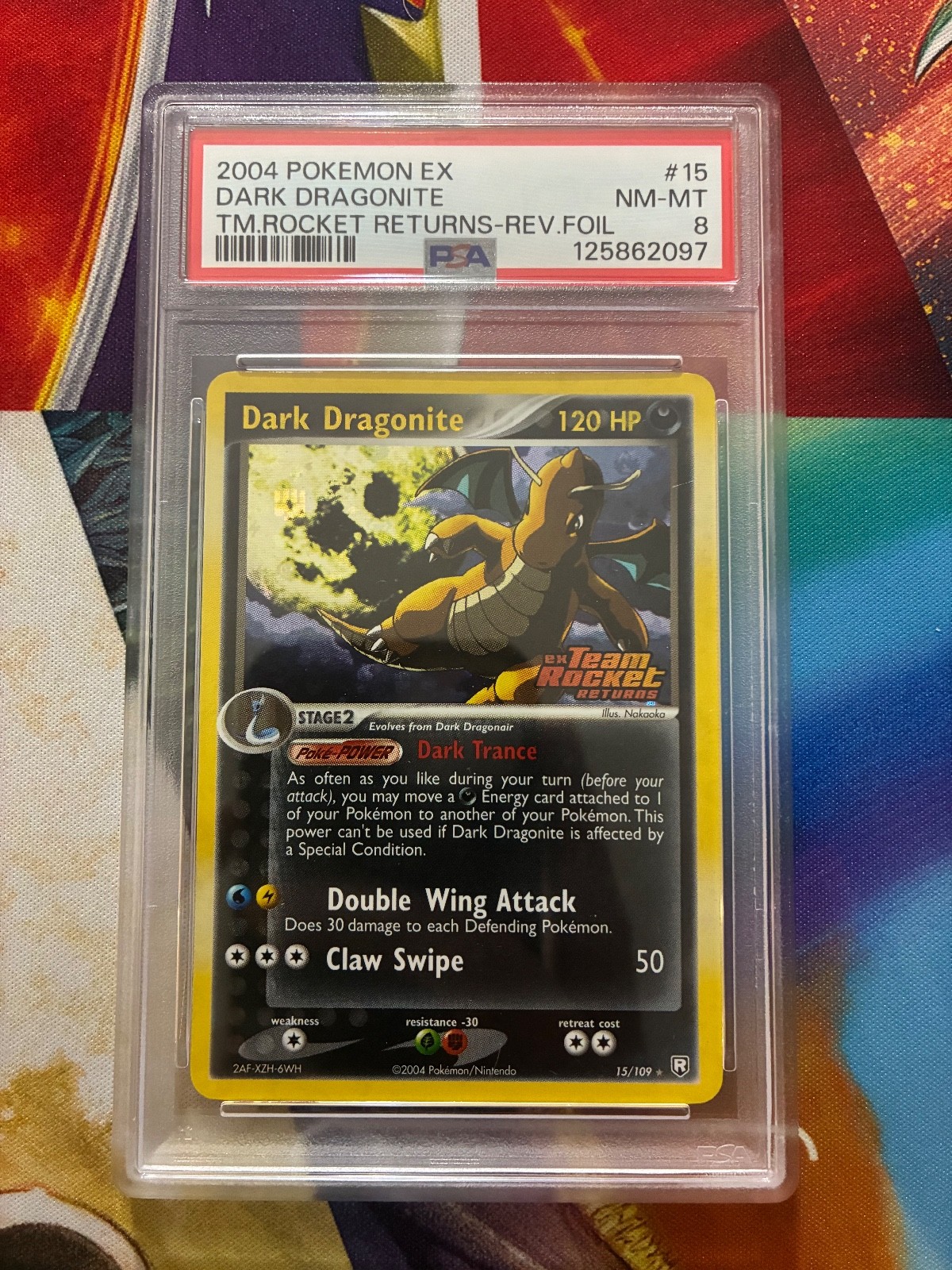 Vintage 2004 POKEMON TEAM ROCKET RETURNS #15 DARK DRAGONITE REVERSE FOIL PSA 8