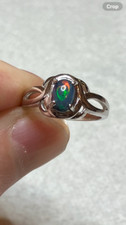 107B- .60ct Genuine Ethiopian Welo Opal set in a Size 7 Sterling Silver Ring