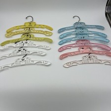 12 Vintage Plastic Childrens Clothing Hangers Humpty, Dolphins, Carousel Ect