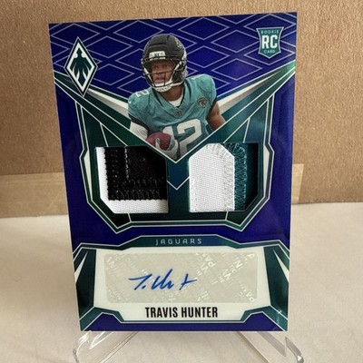 2025 Phoenix #DRP-THR Travis Hunter RPS Dual RC Patch Auto Blue /49 Jaguars
