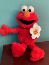 Sesame Street Elmo Loves You Talking Doll Flower. Flowers lights up.