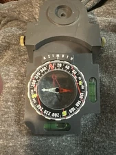 azimuth compass black. a rotating dial marked with degrees, and 2 bubble levels
