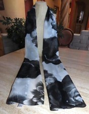Unbranded oblong scarf; white, black; semisheer; 70 x 17 inches; polyester