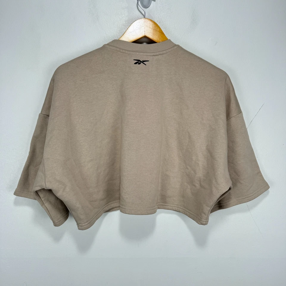 Sudadera corta Reebok X Cardi B Suéter Mujer Grande Beige Gimnasio Atletismo Foto 2 de 4