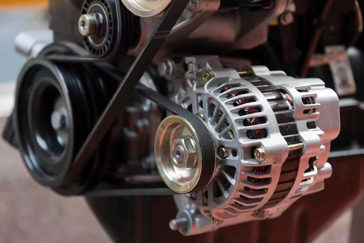 An engine with multiple drive belts.