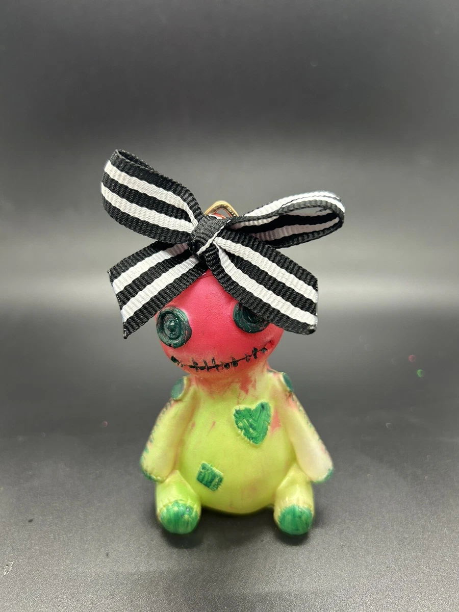Green voodoo doll 2025