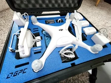 DJI Phantom 4 Drone with case, controller, 4 batteries, extra blades
