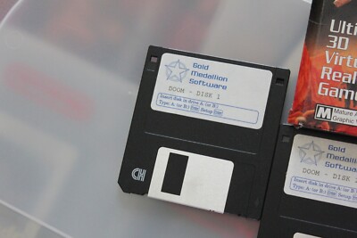DOOM 1993 Shareware Gold Medallion 3.5” Floppy 2-Disc Set Version
