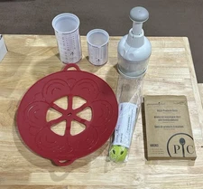 Lot Of 6 Pampered Chef Items chopper, Measuring Cups, Avocado Took, Bags & Cover