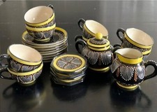 Quimper tea set with 8 cups and saucers, sugar bowl and creamer.