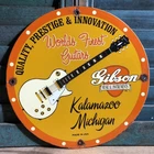 VINTAGE 1973 DATED GIBSON GUITAR MUSICAL INSTRUMENTS PORCELAIN SIGN OIL GAS