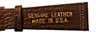 Brown textured leather ladies’ watch band with gold lettering reading “Genuine Leather Made in U.S.A.”