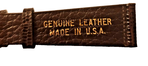 Brown textured leather ladies’ watch band with gold lettering reading “Genuine Leather Made in U.S.A.”