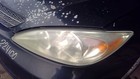 Seat belt front bucket passenger retractor with clear lens and orange reflector on black CAMRY 1038408.