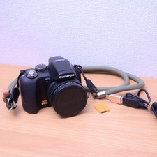 OLYMPUS SP565UZ Stylish Digital Camera with XD Card and USB Cable Included