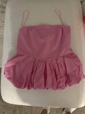 Chic and vibrant pink top by Vigoss. New without tag. Never worn