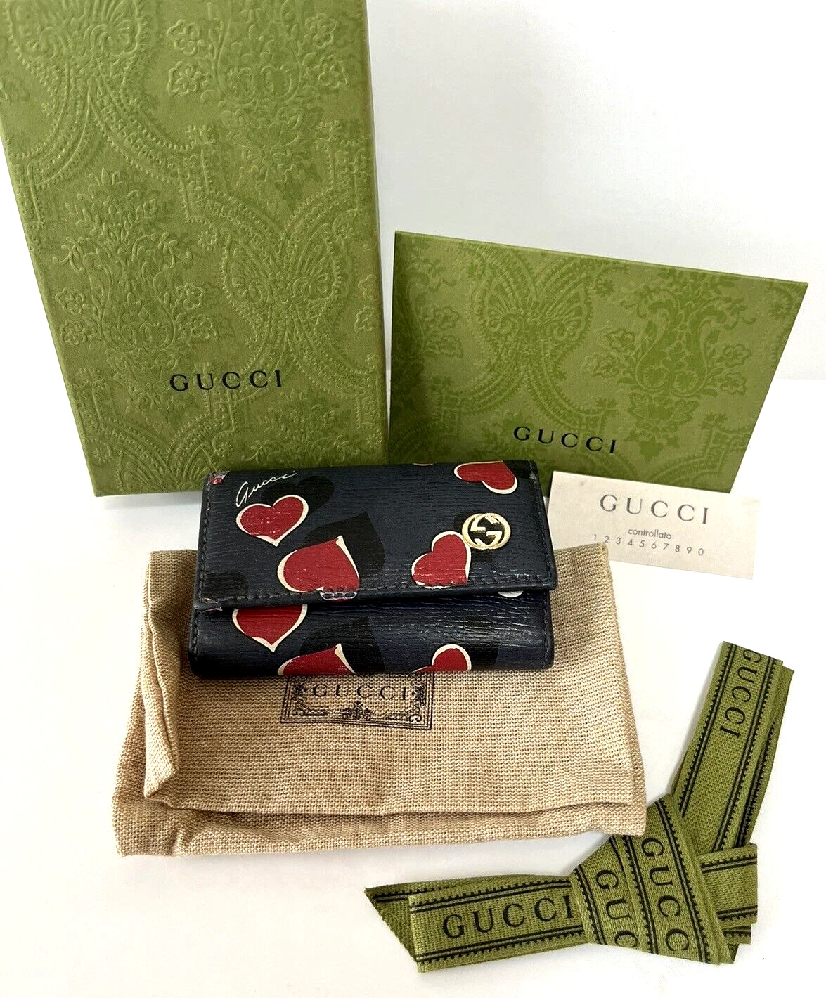 Étui à clés triple pli GUCCI co crochets cuir bleu marine boite et accessoires inclus