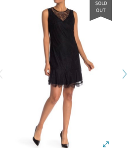 black peplum hem dress