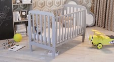 Baby Cot with a mattress. Beautifully designed, wooden, made eco friendly.