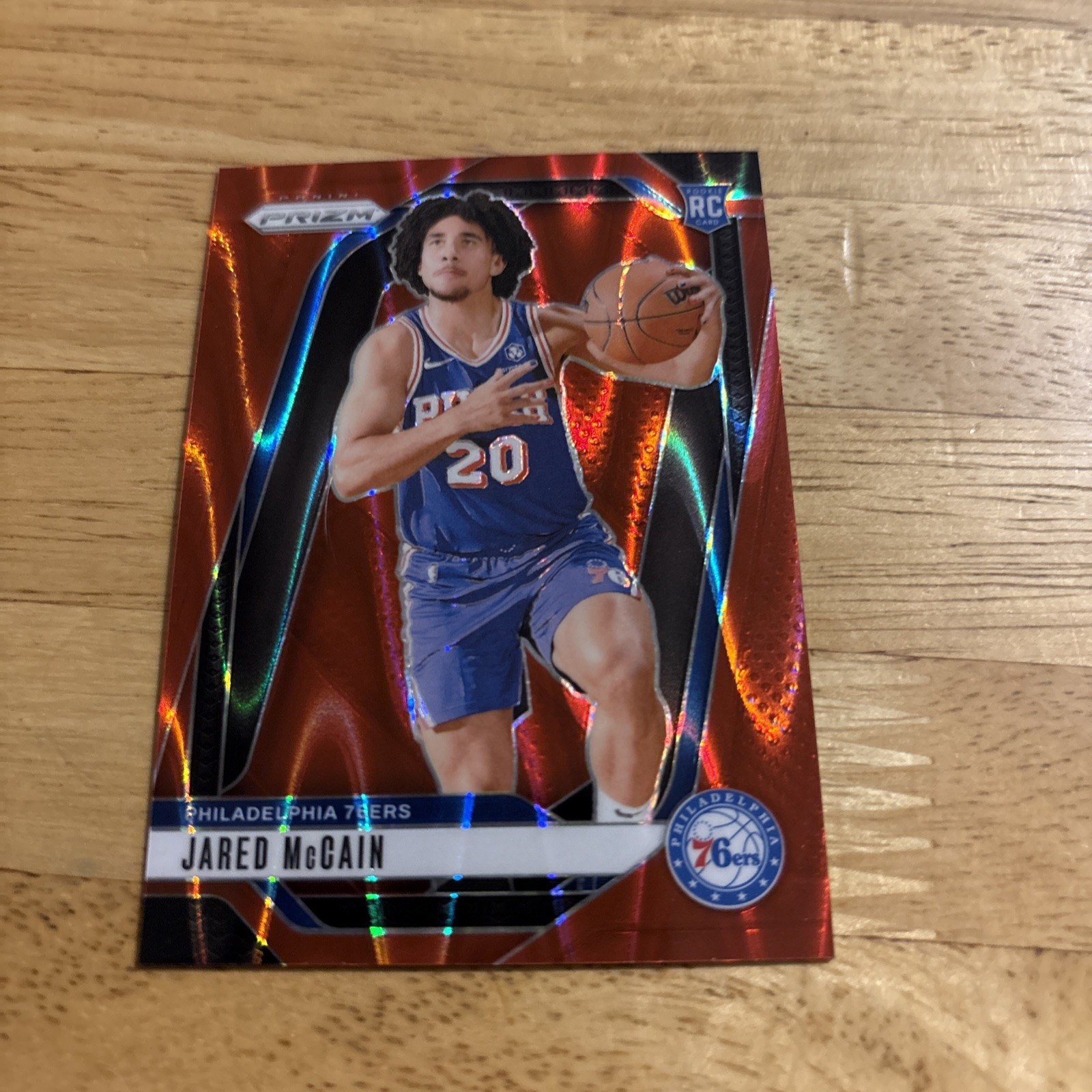 2024-25 Panini Prizm - Jared McCain #222 Red Seismic Prizm /299 (RC)