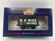 #6669 Bachmann 37-100A 8 Plank End Door Wagon in W E Wise livery.