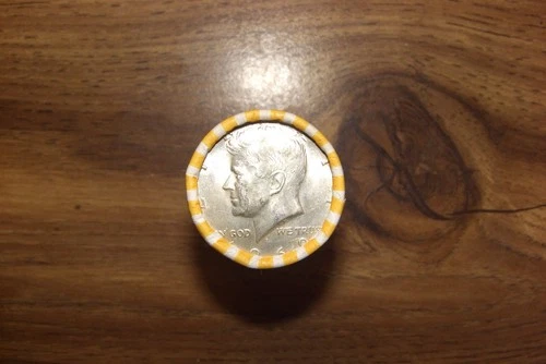 kennedy half dollar roll with a 40% silver 1968 half on end in vV- good cond.