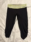 lululemon athletica Women's Capri Leggings 8 Black/Green Stretch Zip Pocket Logo — photo 1