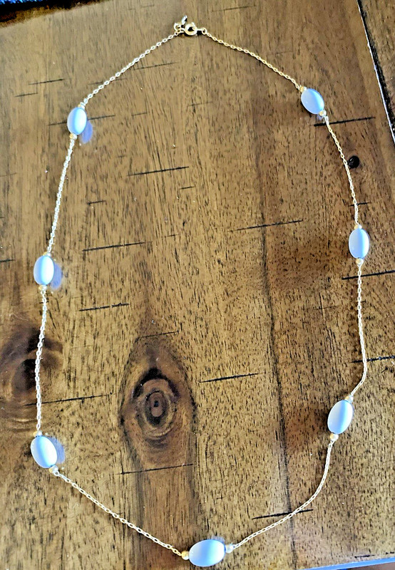 VINTAGE 22" WHITE BEADS ON DAINTY GOLD TONE NECKLACE WITH A "T" OR "CROSS" HANG